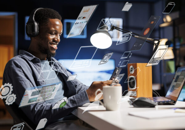 Business person using laptop multitasking to finish daily startup tasks, internet of things concept. Uses artificial intelligence optimization system for productivity, access pc smart things menu.